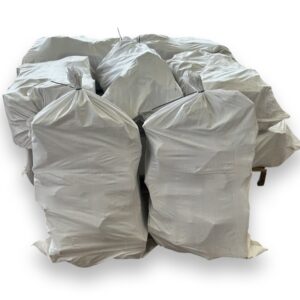 10X Boot Bogs stacked up. boot Bags are white and contain kiln dried logs